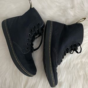 Doc Martens high top shoes.